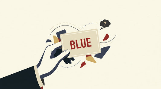 Editorial illustration: a hand holds a playing card with the word BLUE printed in red ink, a visual demonstration of the Stroop effect